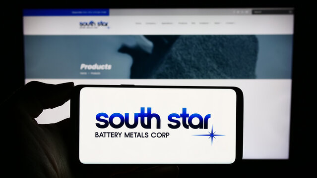 Stuttgart, Germany - 11-06-2023: Person holding smartphone with logo of Canadian company South Star Battery Metals Corp. in front of website. Focus on phone display.