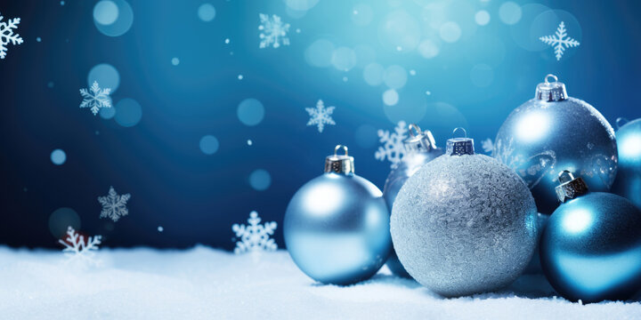 blue christmas background with white dancing snowflakes and christmas balls, free space for text