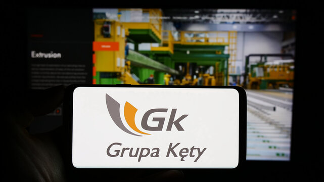Stuttgart, Germany - 11-07-2023: Person holding cellphone with logo of Polish aluminium company Grupa Kety S.A. in front of business webpage. Focus on phone display.