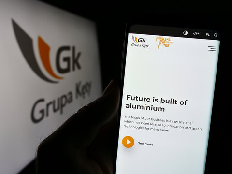 Stuttgart, Germany - 11-07-2023: Person holding mobile phone with website of Polish aluminium company Grupa Kety S.A. in front of logo. Focus on center of phone display.