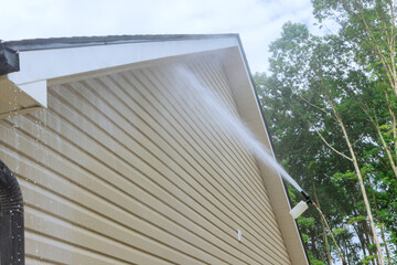 Washing siding houses becomes effortless for service worker as they employ high pressure nozzles to...