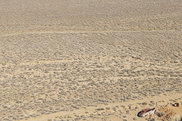 Old rusty car frame in the desert