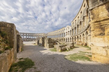 Fototapeta na wymiar View inside the Roman amphitheater in the Croatian city of Pula without people