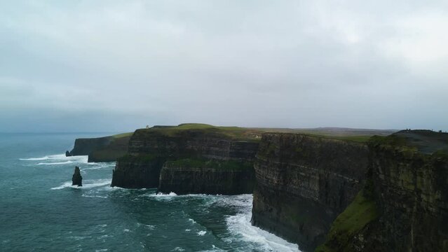 The cliffs of moher with rough seas in connemara Ireland
