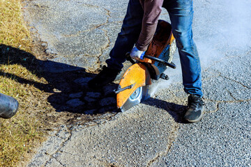 Repairing damaged asphalt cracks before installing new layer asphalt is part of road restoration