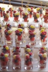 fruits and berries in glass. Catering on wedding. Wedding banquet table. Sweet table with fruits....