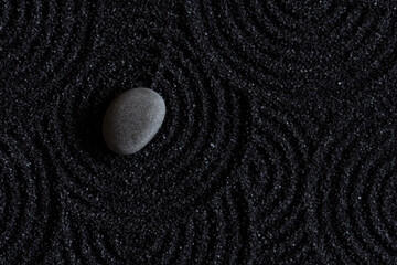 Zen Garden with Grey Stone on Black Sand Wave Pattern in Japanese stye, Rock Sea Stone on Sand...