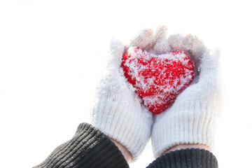 A Heart in the hands of a girl against the sky Valentine's day in a park in nature