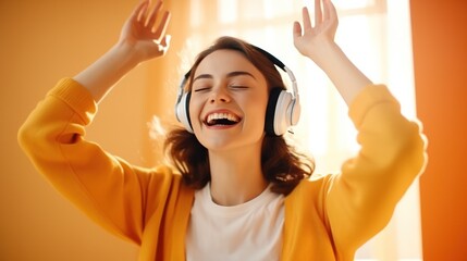 Joyful young women in wireless headphones and enjoy music, having fun, listening to music, raising his arm, dancing to favorite song, enjoying cool soundtrack, happy life.