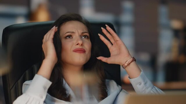 Tensed woman looking laptop evening office closeup. Businesswoman reading email
