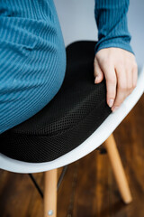 Orthopedic chair cushion, correct posture at the table, programmer's workplace.