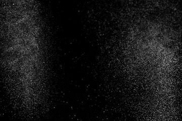Fototapeta na wymiar Abstract splashes of water on black background. Freeze motion of white particles. Rain, snow overlay texture. 