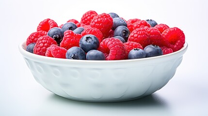  a bowl full of raspberries and blueberries on a white table with a white background and a white bowl full of raspberries and blueberries on a white table.  generative ai - Powered by Adobe