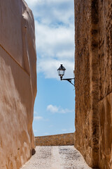 narrow street with a streetlight. Beautiful corners of ibiza