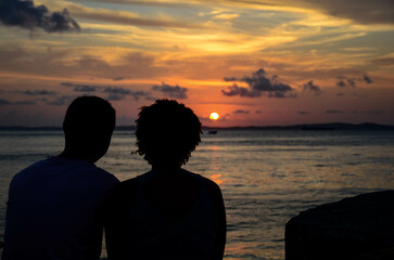 Couple in love watching the sunset
