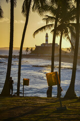 Beautiful scene of the sunset with Barra Lighthouse in the background