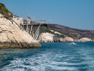 view from the boat of the famous rock caves of the Gargano coast