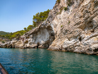 view from the boat of the famous rock caves of the Gargano coast
