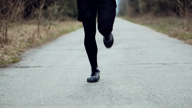 Triathlete preparing for jogging, sprinting and stamina exercises	