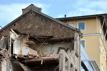A house with crumbling walls destroyed by a rocket attack