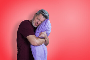 Man scared by nightmare and holding pillow. Stress emotions concept