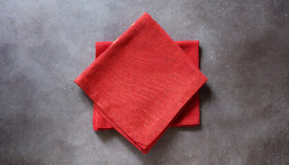 top view with red empty kitchen napkin isolated on table background folded cloth for mockup with copy space flat lay minimal style