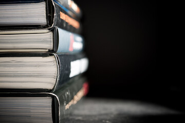Closeup of hardcover books piled on a table