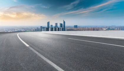 asphalt highway road and city skyline background