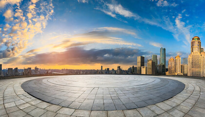 round city square and city skyline with sky clouds at sunset panoramic view