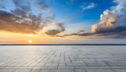 Fotobehang empty square floor and coastline with sky clouds at sunrise © William