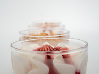 Ice cream on a white background. Ice cream in a plastic cup on a white background.