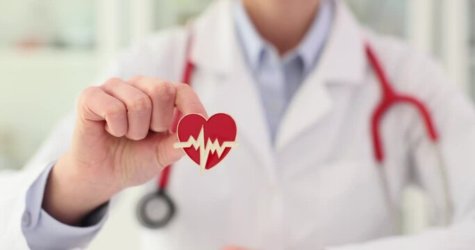 Doctor holding heart rate icon concept - Powered by Adobe