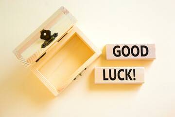 Good luck symbol. Concept words Good luck on beautiful wooden block. Beautiful white table white background. Empty wooden chest. Business, motivational good luck concept. Copy space.