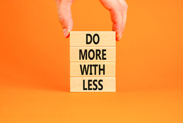 Do more with less symbol. Concept word Do more with less on beautiful wooden block. Beautiful...