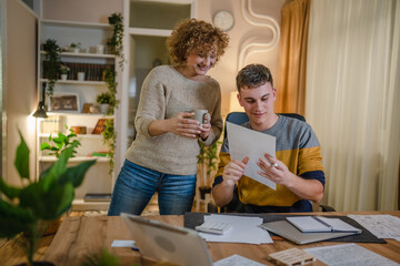 mature woman and son caucasian man teenager receive letter read good news student get scholarship or invitational letter from university share good news and excitement with his mother real people