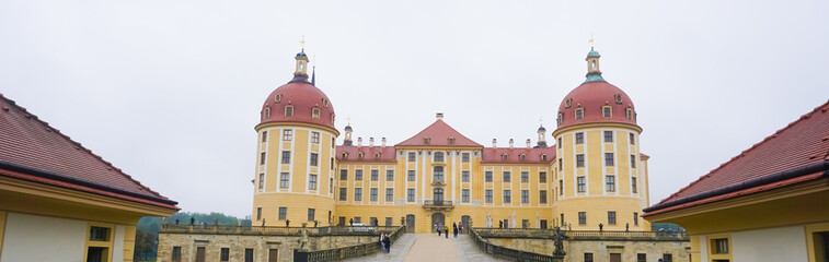 Fototapeta na wymiar Moritzburg Castle is located near Dresden in the Saxon village of Moritzburg. The popular fairy tale Three Nuts for Cinderella