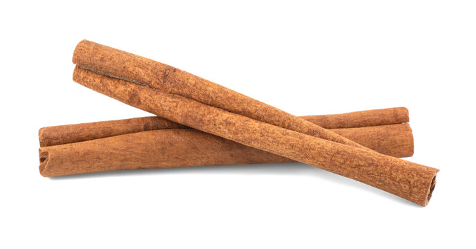 Two cinnamon sticks isolated on white background with shadow