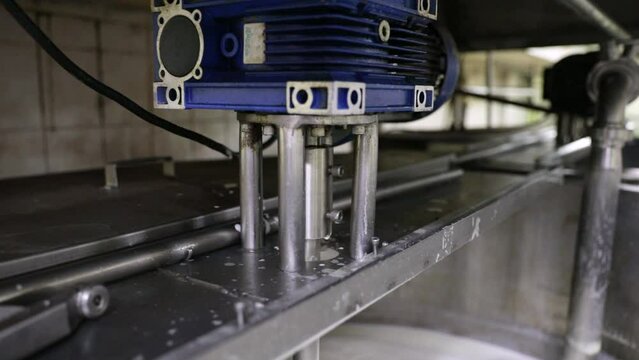 Food industry and processing. Closeup view of an industrial mixer component. 