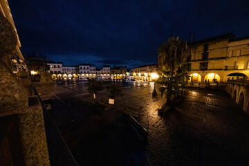 Fototapeta na wymiar Evening lights adorn Trujillo's main square.