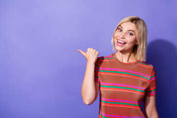 Photo of young cheerful positive girl enjoying culinary receipts website for housemaids...
