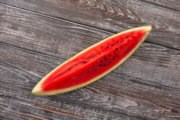 watermelon slice on wood background top view