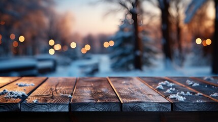 Winter xmas background with empty space on table top in front. Christmas horizontal blank scene. Wooden table top in front, blurred сhristmas tree in the snow. Snowy scene - obrazy, fototapety, plakaty