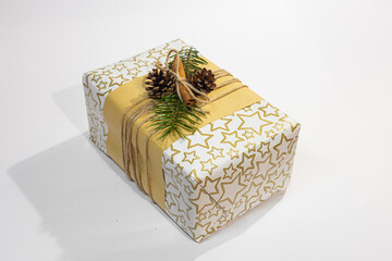 Christmas, New Year gifts. Presents. Beautiful boxes, ribbons and decorations. tree cones on white background. red. craft paper. Holiday. original. cinnamon. candy. Package Design