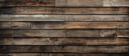 Deurstickers The background of the old wooden architecture showcased a beautiful pattern of weathered rectangular timber highlighting the craftsmanship of traditional carpentry and the durability of hard © TheWaterMeloonProjec