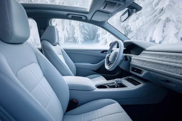 Fotobehang Frozen car interior. Snow and ice inside vehicle. Driving in winter season. © Lazy_Bear