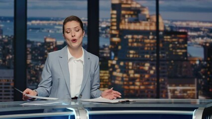 Friendly newsreader speaking newscast evening studio closeup. Tv broadcasting