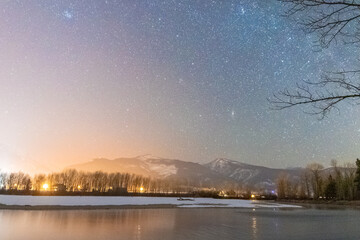 Beautiful Winter Sky Over River And Mountains