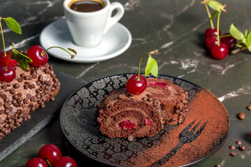 Chocolate roll cake with cream and cherries.