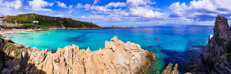 Italy summer holidays. Sardegnia island nature scenery. one of the most beautiful beaches - Santa Teresa di Galura in northern part with turquoise sea and incredible rock formations - obrazy, fototapety, plakaty