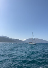 Yachts are sailing ahead on the course. Ithaca Greece